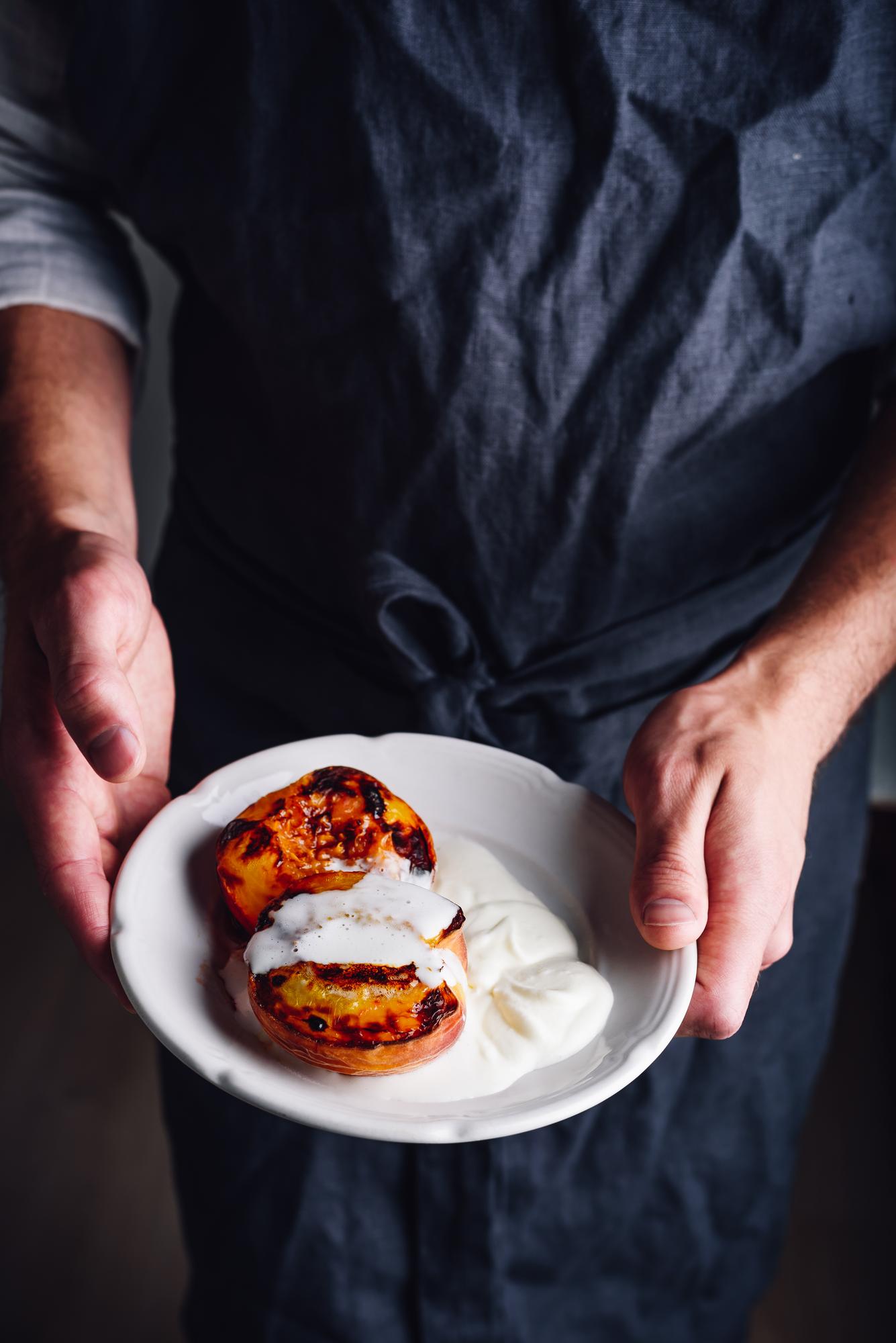 Chef demonstrating precise plating technique
